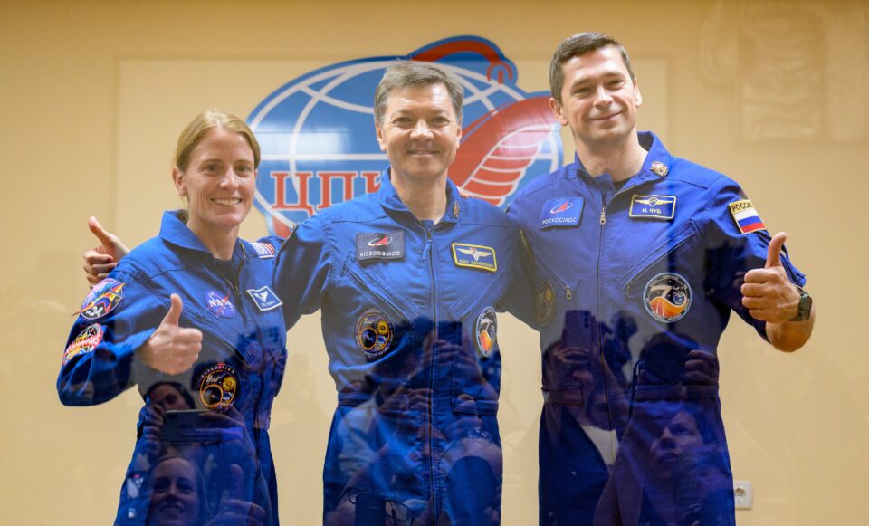 Expedition 70 astronauts pose for a portrait inside their crew quarters