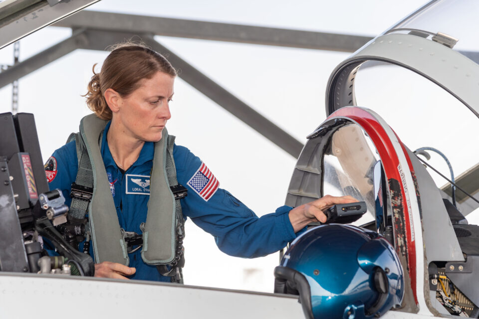 Astronaut Loral O’Hara boards a T-38 trainer jet